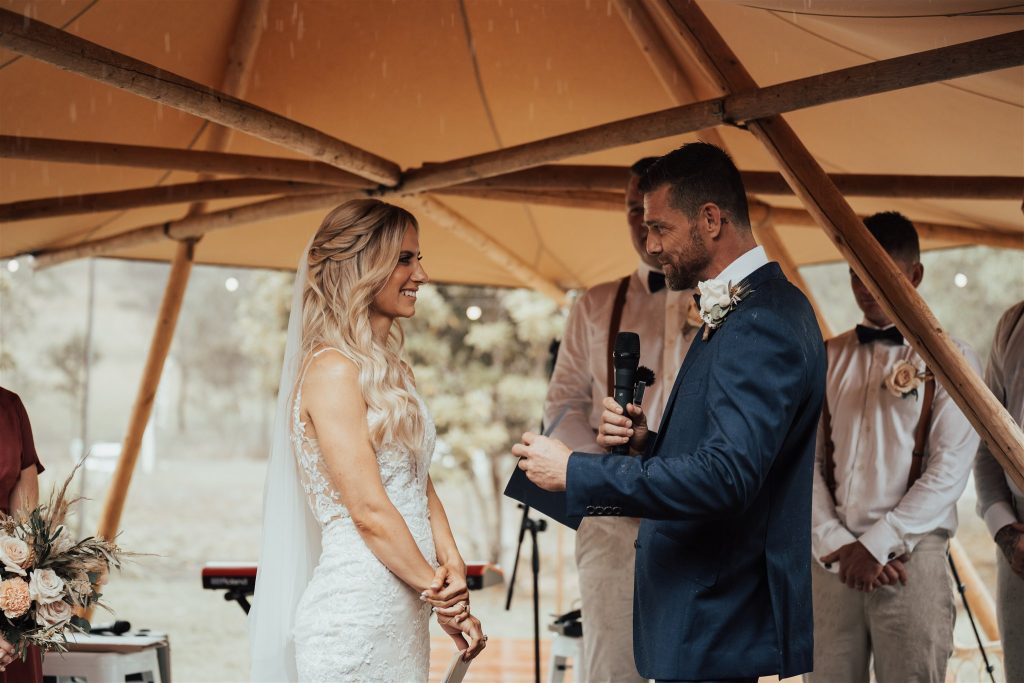 rainy wedding ceremony under canopy