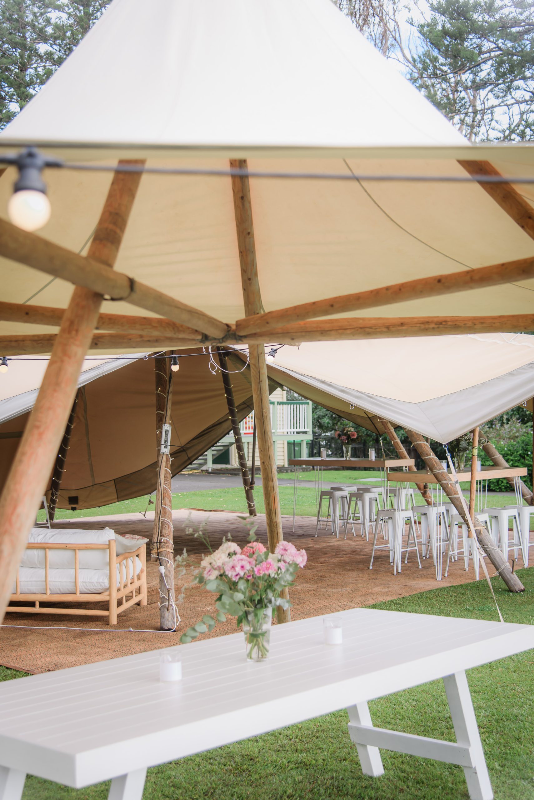 large & small tipi with cocktail furniture for wedding reception