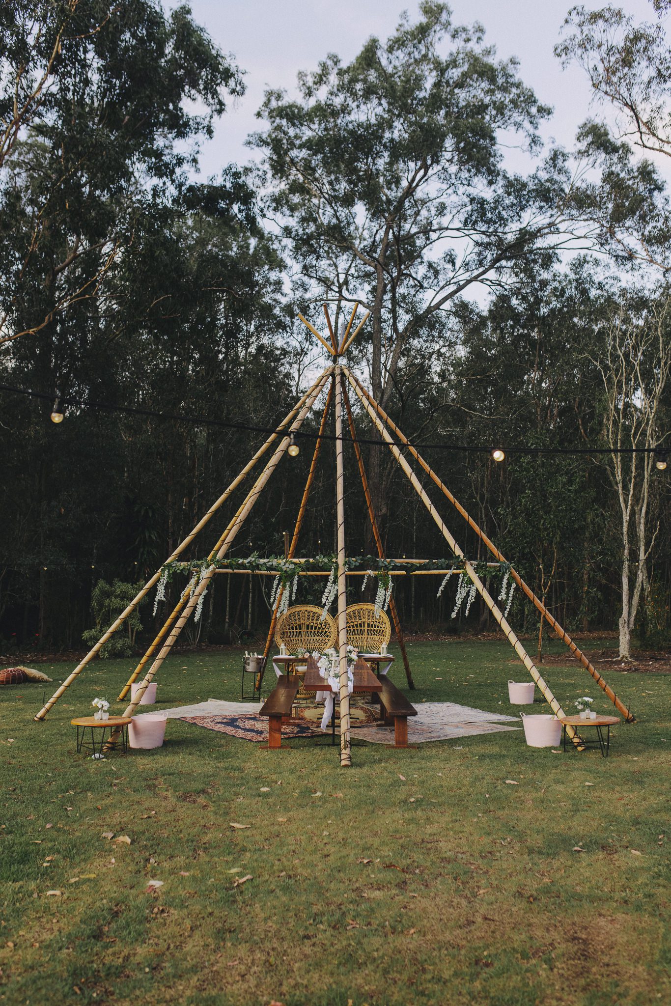 Naked tipi wrapped in fairy lights